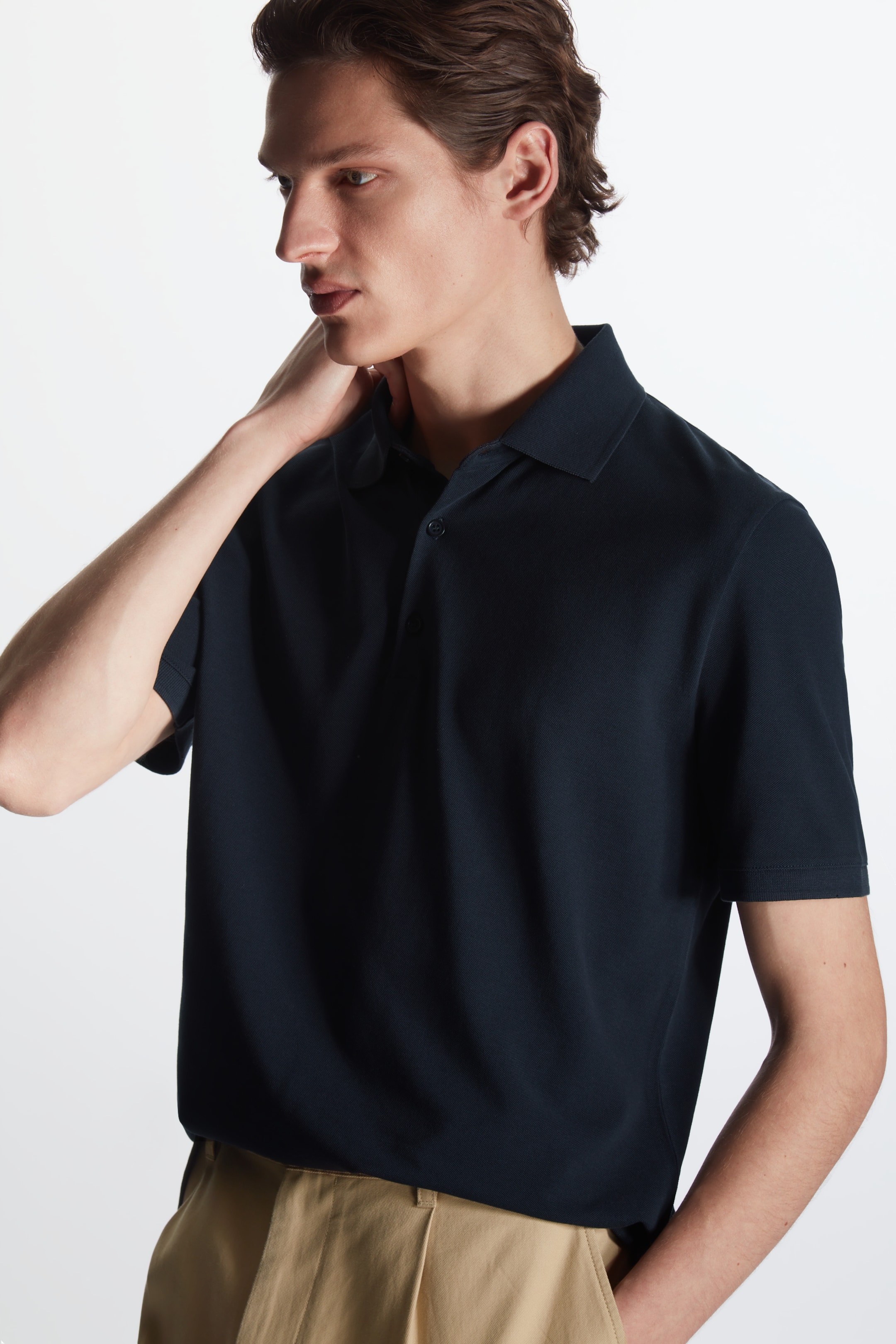 Front image of cos REGULAR-FIT PIQUÉ POLO SHIRT in DARK NAVY