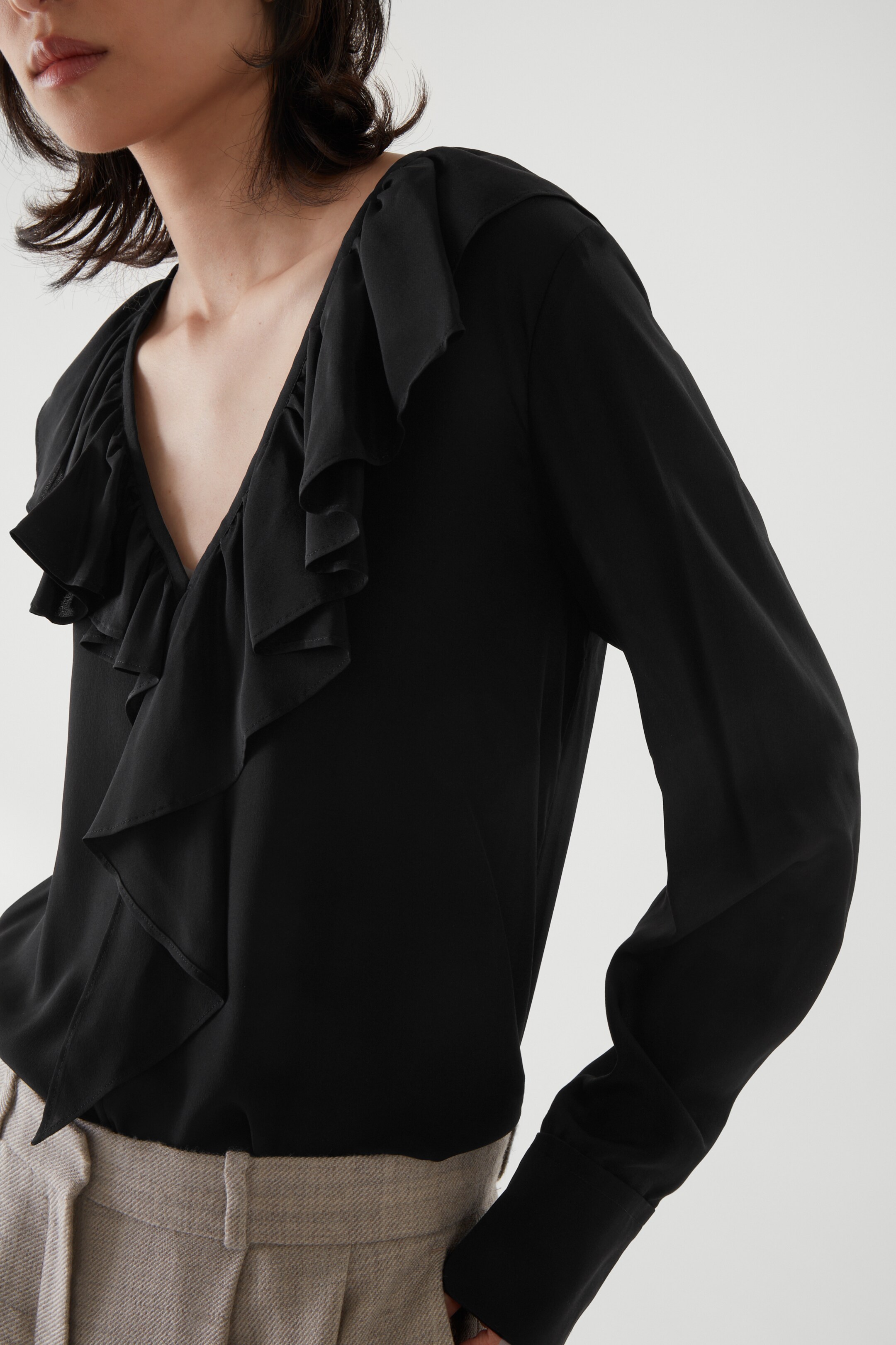 Front image of cos RUFFLED BLOUSE in BLACK