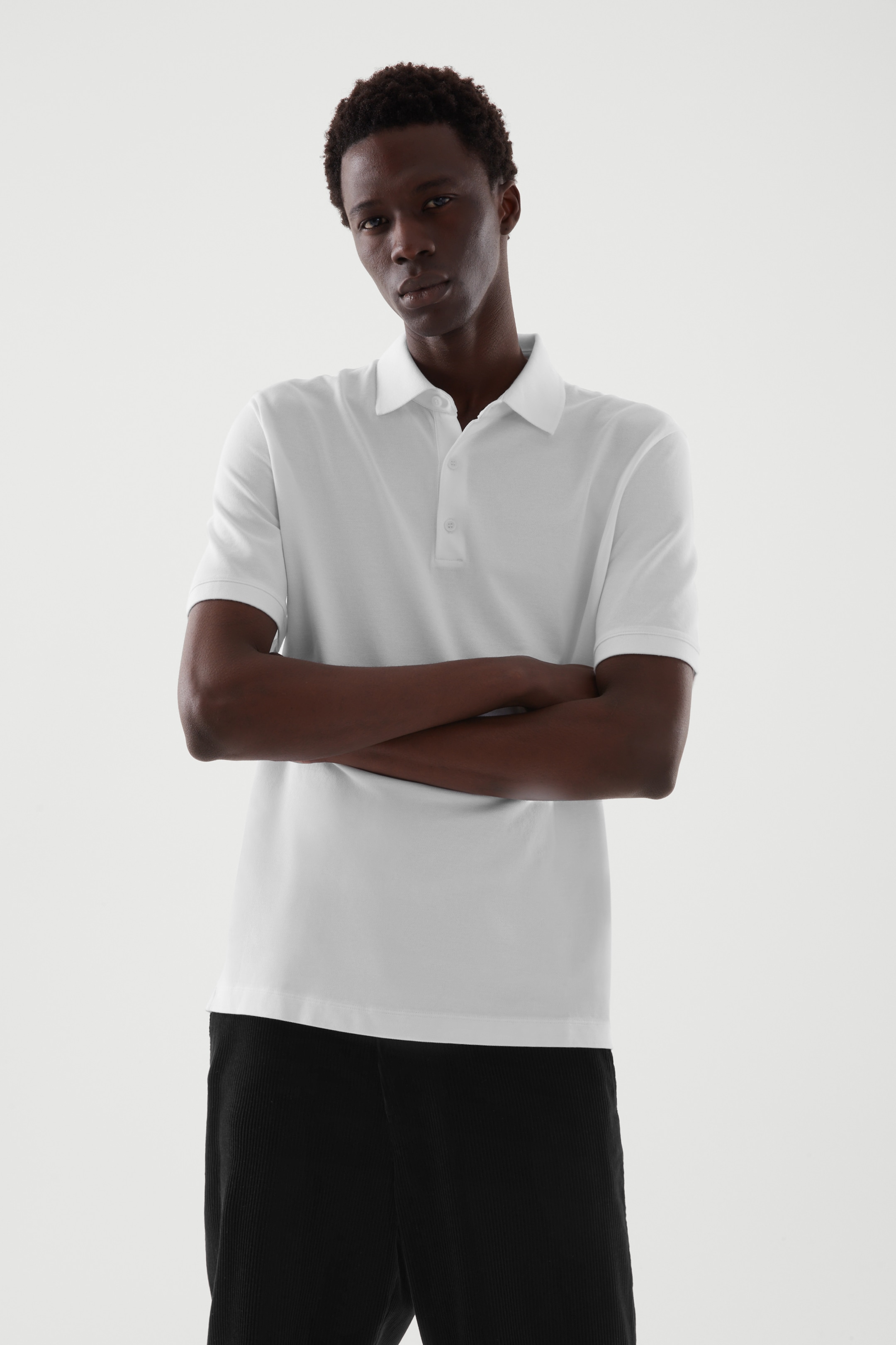 Front image of cos REGULAR-FIT PIQUÉ POLO SHIRT in WHITE
