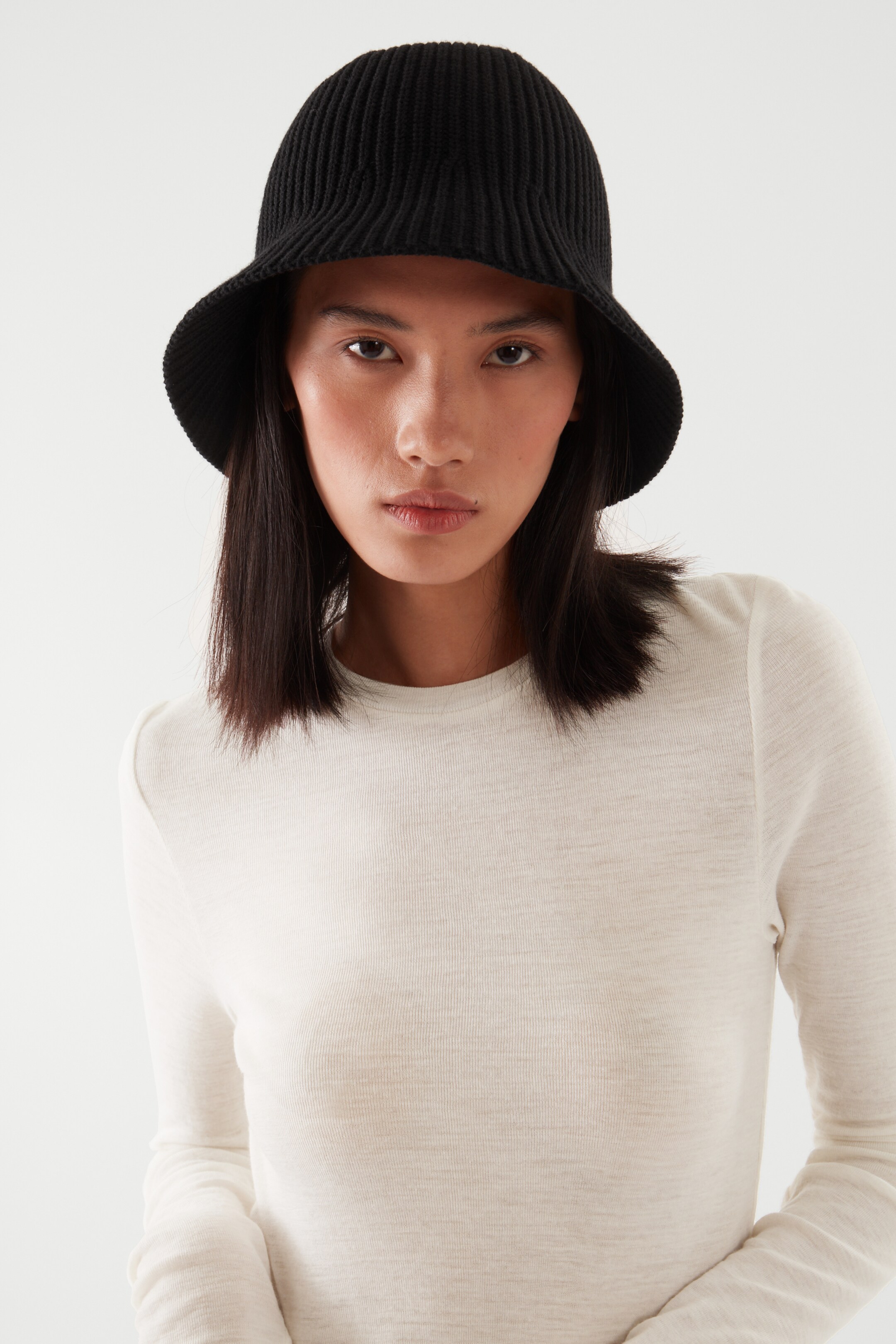 Front image of cos KNITTED BUCKET HAT in BLACK