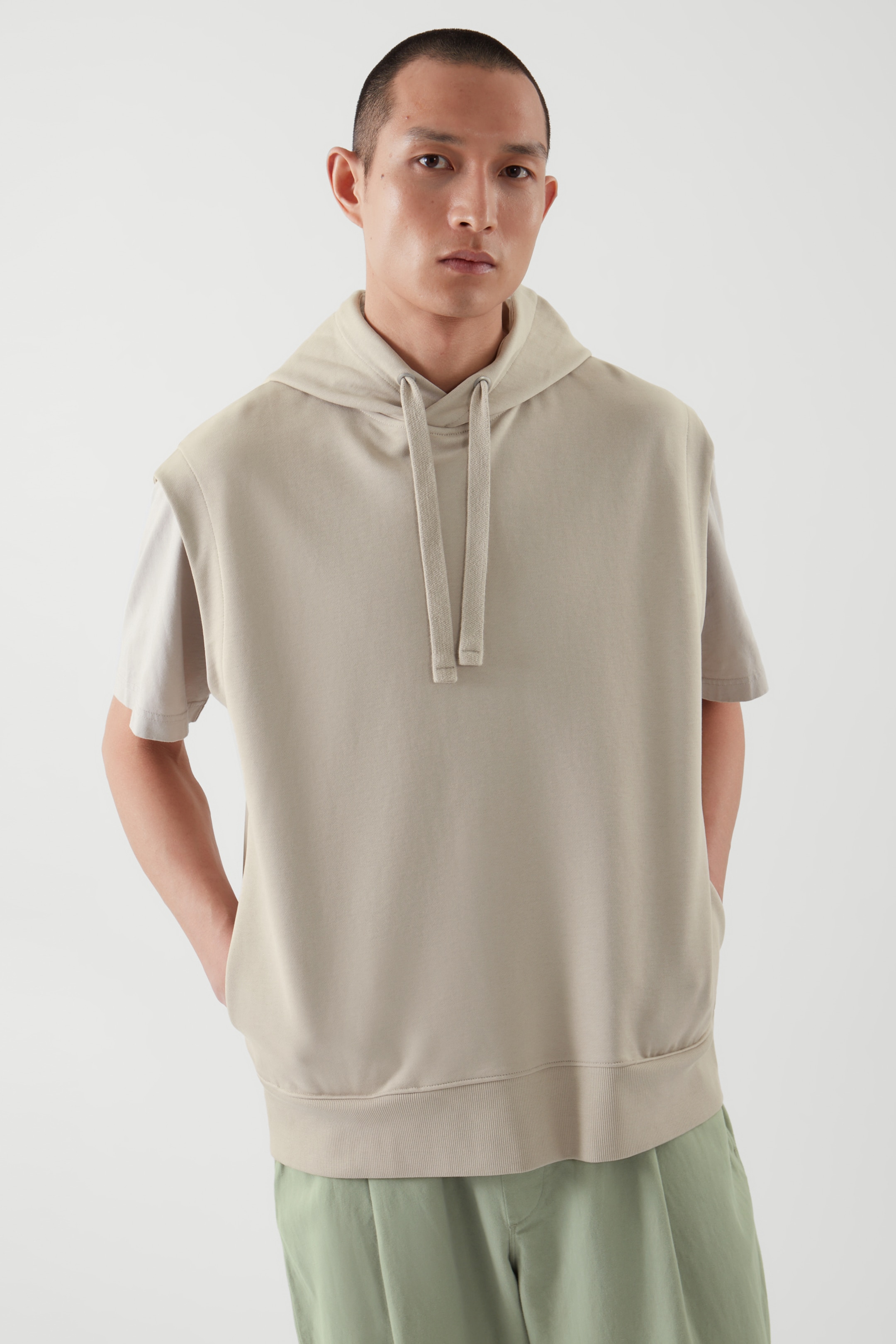 Front image of cos RELAXED-FIT SLEEVELESS HOODIE in LIGHT BEIGE