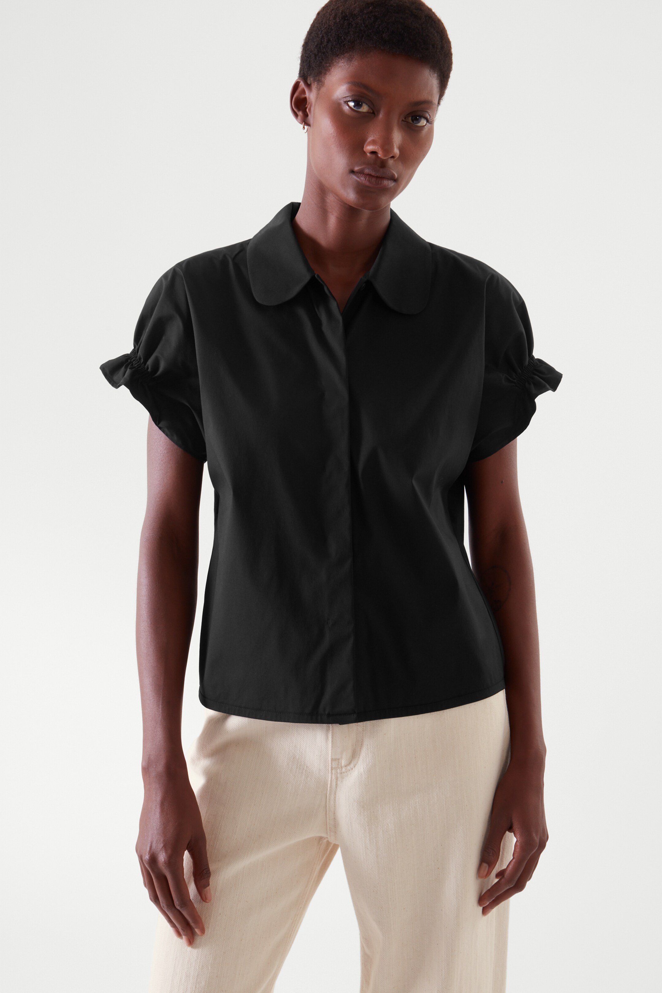 Front image of cos SMOCKED SHORT-SLEEVE SHIRT in black