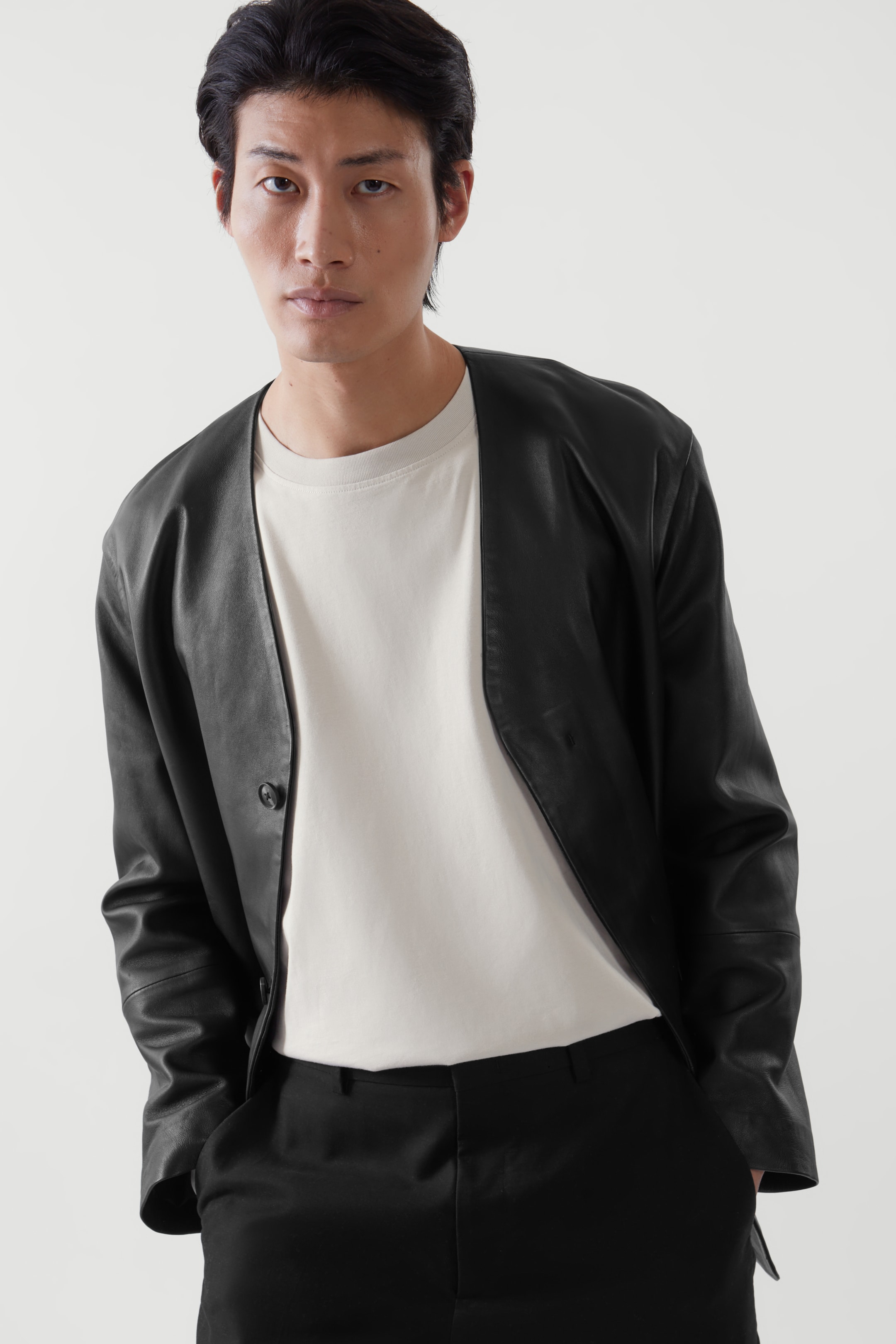 Front image of cos RELAXED-FIT COLLARLESS LEATHER JACKET in BLACK