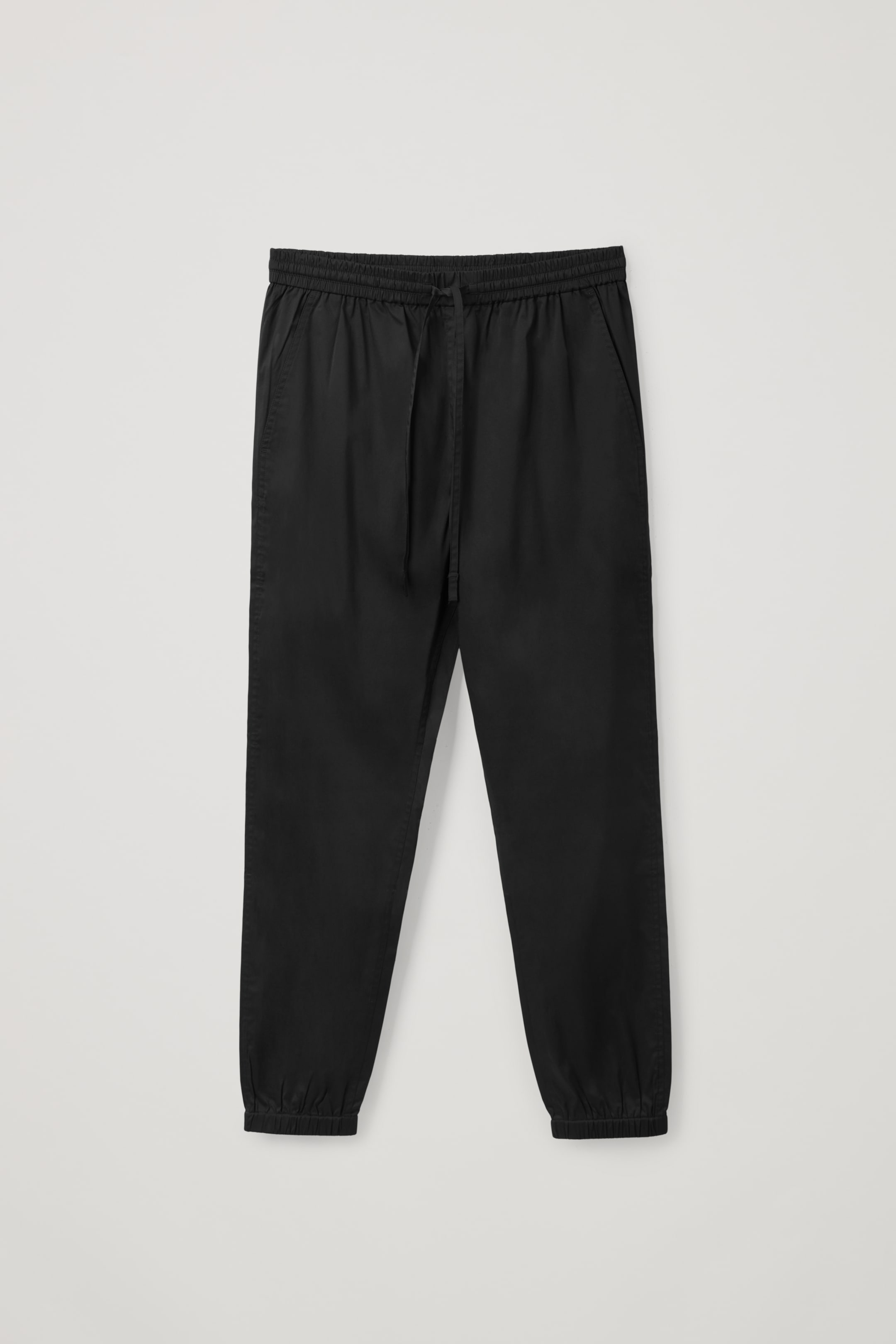 Front image of cos SLIM-FIT DRAWSTRING CUFFED PANTS in Black